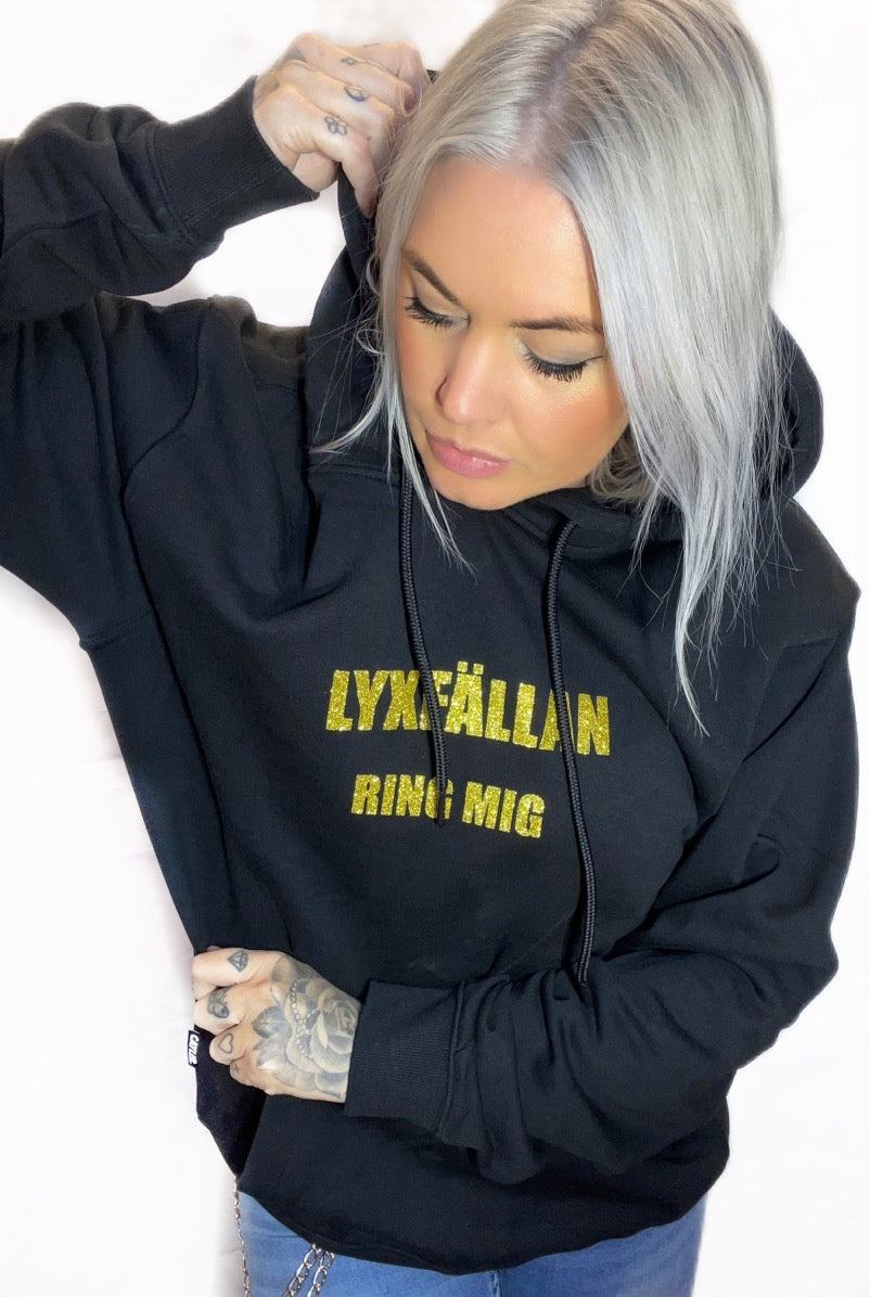 Rebell hoodie lyxfällan tryck svart/glitter unisex
